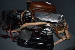 A selection of canon Cameras and a vintage Optima 1 and case.