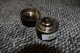 A leather cased travelling ink well.