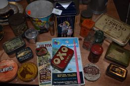 A selection of advertising items including transfer printed tins