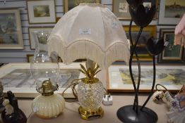 a pineapple style table lamp and similar oil burner