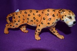 A ceramic figure of an African cat possibly Cheetah by Beswick