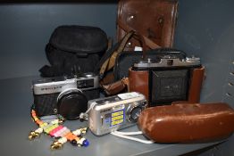 A selection of photographic equipment and cameras including Olymups 35