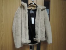 A ladies cream faux fur coat with hood by papaya,size 12, as new with tags.