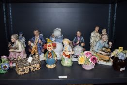 An assorted lot of figurines and ornaments among which are Crown Staffordshire and similar floral