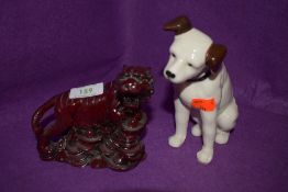 A ceramic figure of a dog in the HMV style and Chinese tiger