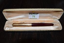 A boxed Parker pen having 12ct lid.