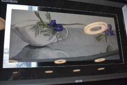 A modern print and frame of a flower