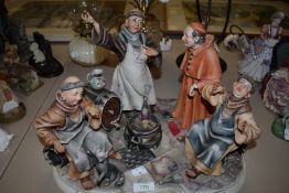 A ceramic figure base by Cappo De Monte depicting monks getting drunk