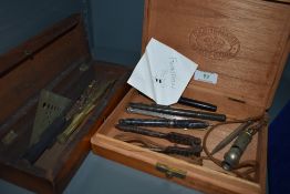 A box of vintage fountain pens and other items, also included is a whistle 'The city whistle'.