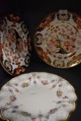 Three Royal Crown Derby plates, two having Imari pallet and the other having fluted edges,delicate