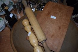 A large vintage wooden bowl, a rolling pin and similar.