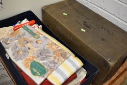 A collection of vintage and retro table linen and similar in an advertising box for Fairfield