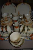 Two art deco tea services both having floral designs one being hand painted