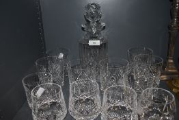 A set of whiskey tumblers and decanter also similar Waterford tumblers.