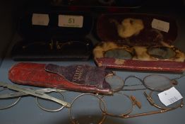 A selection early yellow metal rimmed spectacles.