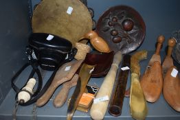 An assortment of vintage items including tambourine, Rank Aldis camera, butter paddles, shoe horns