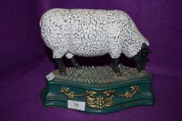 A cast iron sheep door stop.