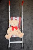 A vintage childrens Play buggy and teddy bear