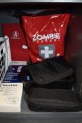 A selection of medical equipment including a waterproof first aid kit and similar.