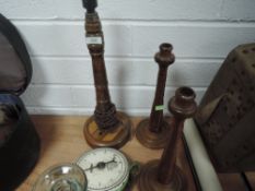 Two antique wooden candle sticks, stamped JBM to underside,a lamp base with inlaid detailing to