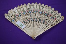 An ivory Brise fan, around 1815, with painted roses and forget-me-nots to front and similar to