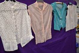 Four 1950s blouses in various colours,fabrics and styles, in smaller sizes.