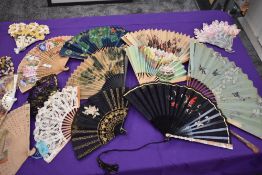 A selection of around eleven mainly mid century fans, including some advertising fans for B0AC etc.