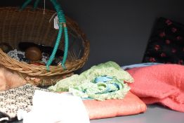 A basket full of vintage and antique items including costume jewellery, handkerchiefs and case,