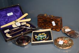 A selection of vintage compacts and a manicure set in early plastic tortoiseshell effect case.