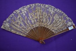 A lace fan having sequins and spangles with early plastic ribs, around early 20th century.