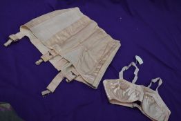 A pale pink CC41 girdle and bra,bra still having original price attached,smaller sizes.