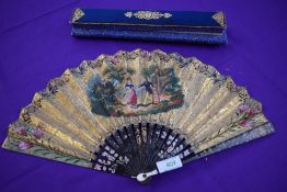 An early 19th century fan, thought to be for the Chinese export market having hand painted scenes to