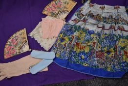 Two vintage paper fans an apron a set of gloves and similar.