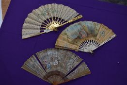 A lot of three 19th century fans, painted silk leaf fan with gilded wooden ribs,another in silk with