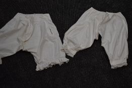 Two pairs of Victorian bloomers, crisp cotton with both having intricate details to the legs, both