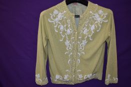 A 1950s mint green Jaeger cashmere cardigan with extensive beadwork, medium size approx.