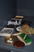 A collection of compacts including Stratton, one unusual green and silver tone Japanese compact with