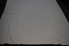 An antique white Marseille bed throw with floral motifs and similar.