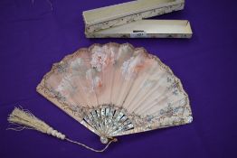 A 19th century Fan in box,having mother of pearl ribs with gilt detailing and silk painted leaf with