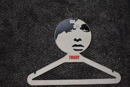 A collectable and iconic late 1960s original Twiggy coat hanger.