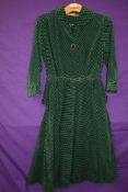 A vintage 1950s Peggy page dress in green and black checked corduroy with belt and contrasting