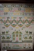 A framed cross stitch sampler worked by E Wier 1992, depicting animals,house,alphabet and more.