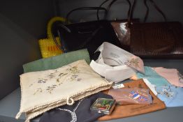 A mixed lot of vintage items including clasp fastening handbags, collars, handkerchiefs and case and