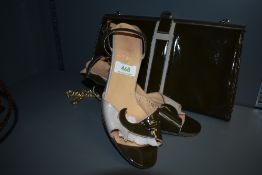 A pair of 1980s Reggie Fancetti high heeled sandles and matching bag.