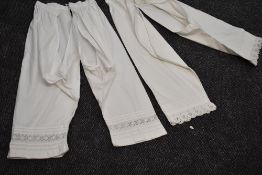 Two pairs of Victorian split leg bloomers with delicate trimming to legs and drawstring fastening to