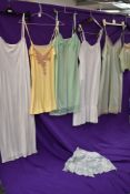 Five vintage slips, a camisole top and a pair of cami knickers, including silk,rayon and nylon,