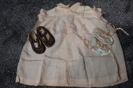 Two pairs of baby shoes and a smock dress, around 40s/50s.