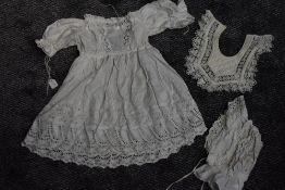 An antique chidrens gown with deep hem of cut work and embroidery ,drawstrings to cuffs and back,a