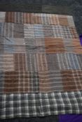 Three vintage quilts, two patchwork with wools and similar, the other having a border with a coral