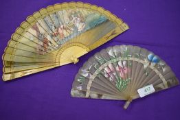 Two fans, one around 19th century depicting a classical scene,the other early 20th century having